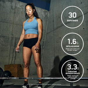 Woman in athletic wear standing next to a weight rack with nutritional information displayed.